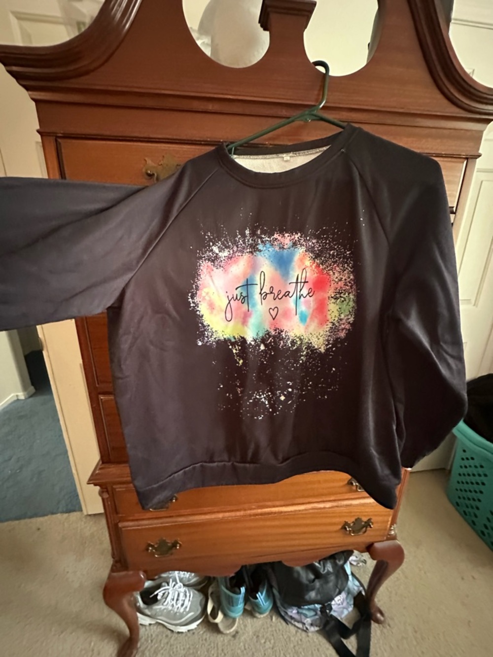 Black Sweatshirt with Colorful 'Just Breathe' Graphic